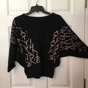 Black, graphic, dolman 3/4 sleeve top. No tags. Size small